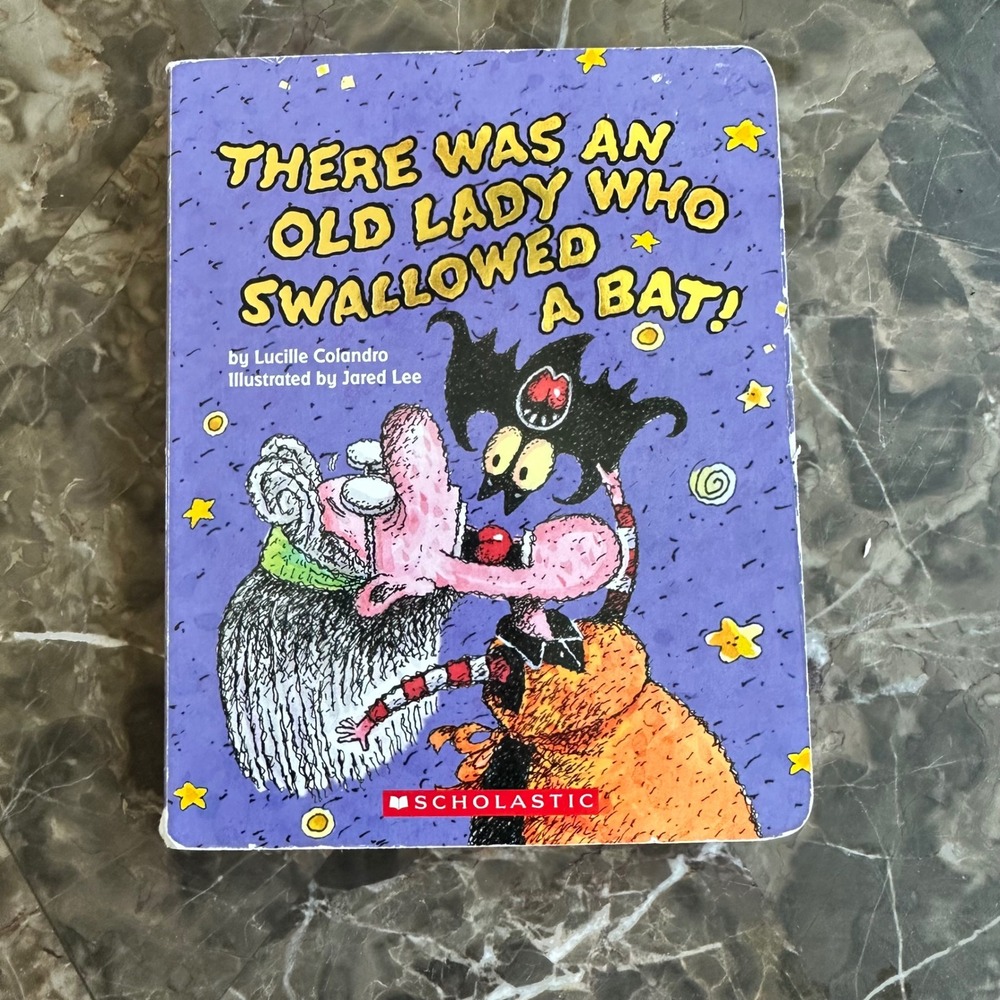There Was an Old Lady Who Swallowed a Bat! Board Book Lucille Colandro Halloween